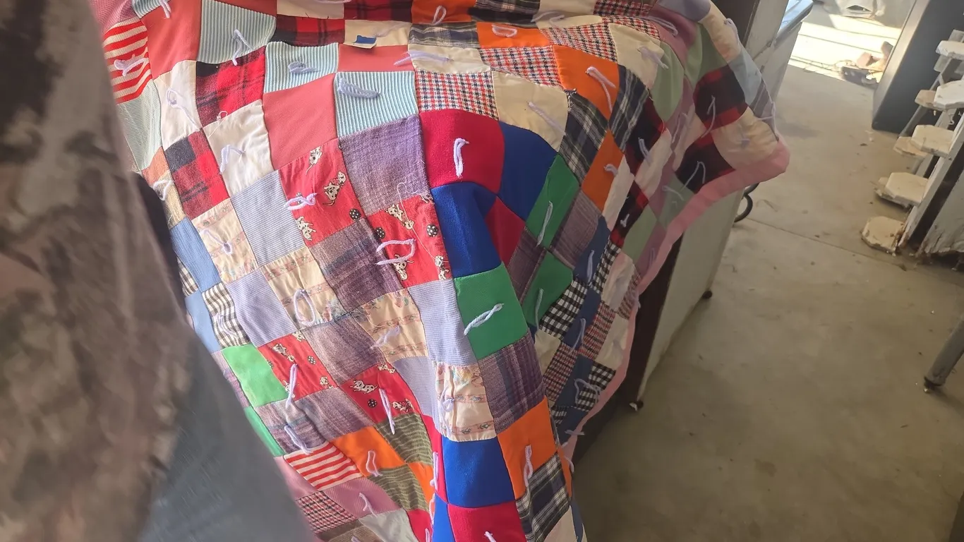 Vintage twin sized tied knot quilt