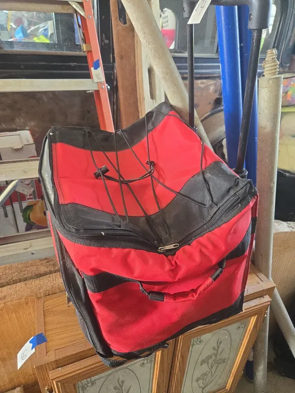 Portable insulated rolling cooler