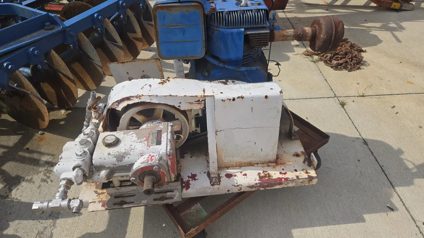 Briggs and Stratton, 18 horse vertical shaft engine mounted with a belt driven giant brand pump numb