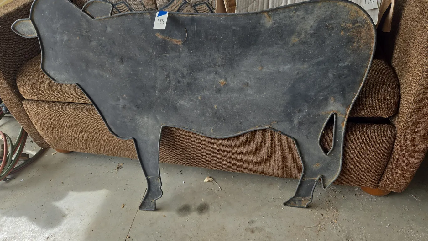 Vintage black metal cow sign