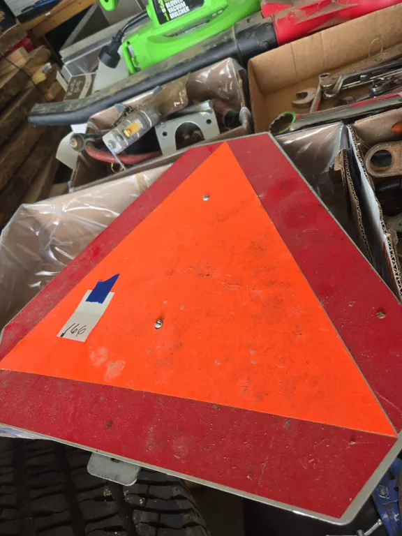 Slow moving vehicle sign
