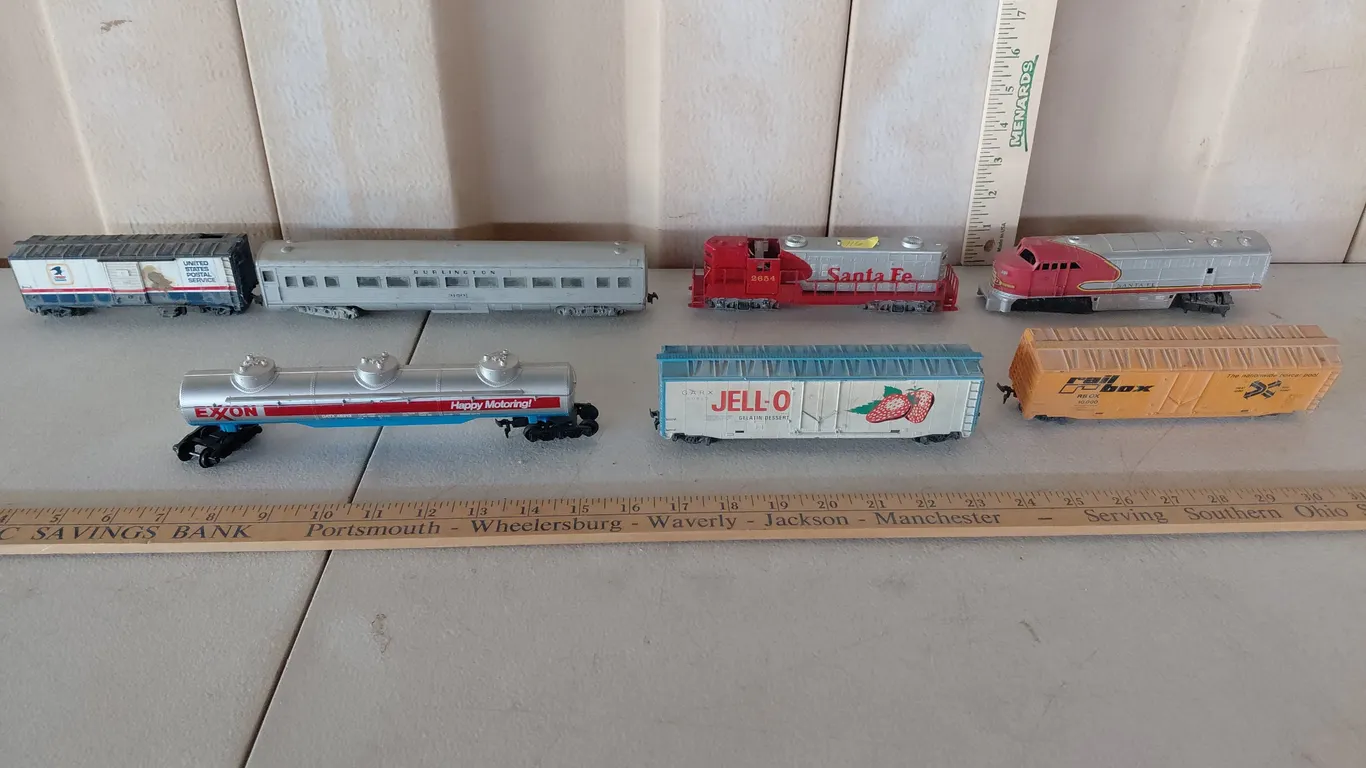 7 Assorted Train Cars, Some May Have Damage/Missing Pieces