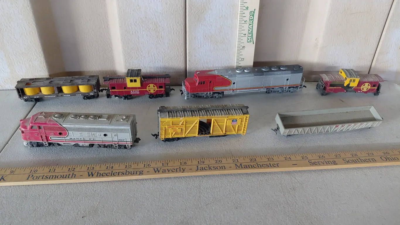 7 Assorted Train Cars, Some May Have Damage/Missing Pieces