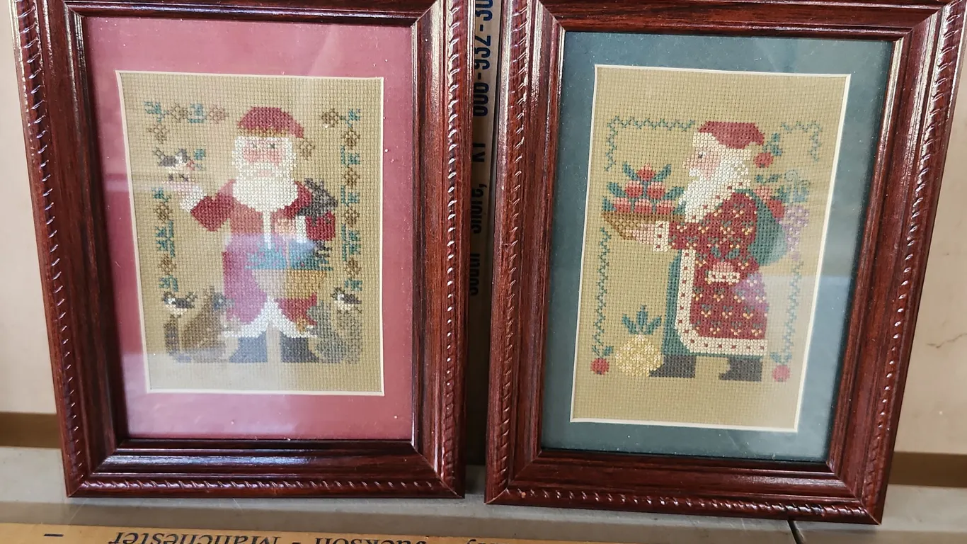 2 Vintage Hand Made Cross Stitch Folk Art Santas Framed 6.75"X8.75"