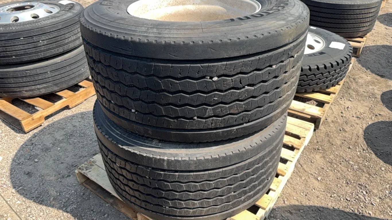 2) Bridgestone 445/50R22.5 super singles on alum wheel