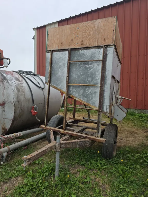 Portable feed hopper on wheels