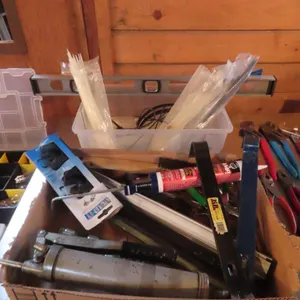 Lot - Box of Zip Ties, Level, Assorted Tools *Located at Spruce Grove location.
