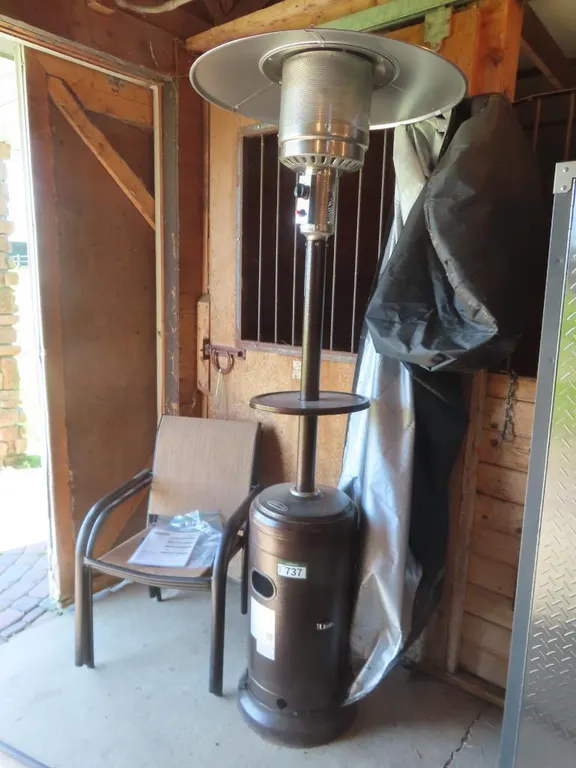 Lot - Hiland HLDS01-CG Propane Outdoor Patio LPG Heater S/N 2017147989 and (2) Stacking Patio Chairs *Located at Spruce Grove location.