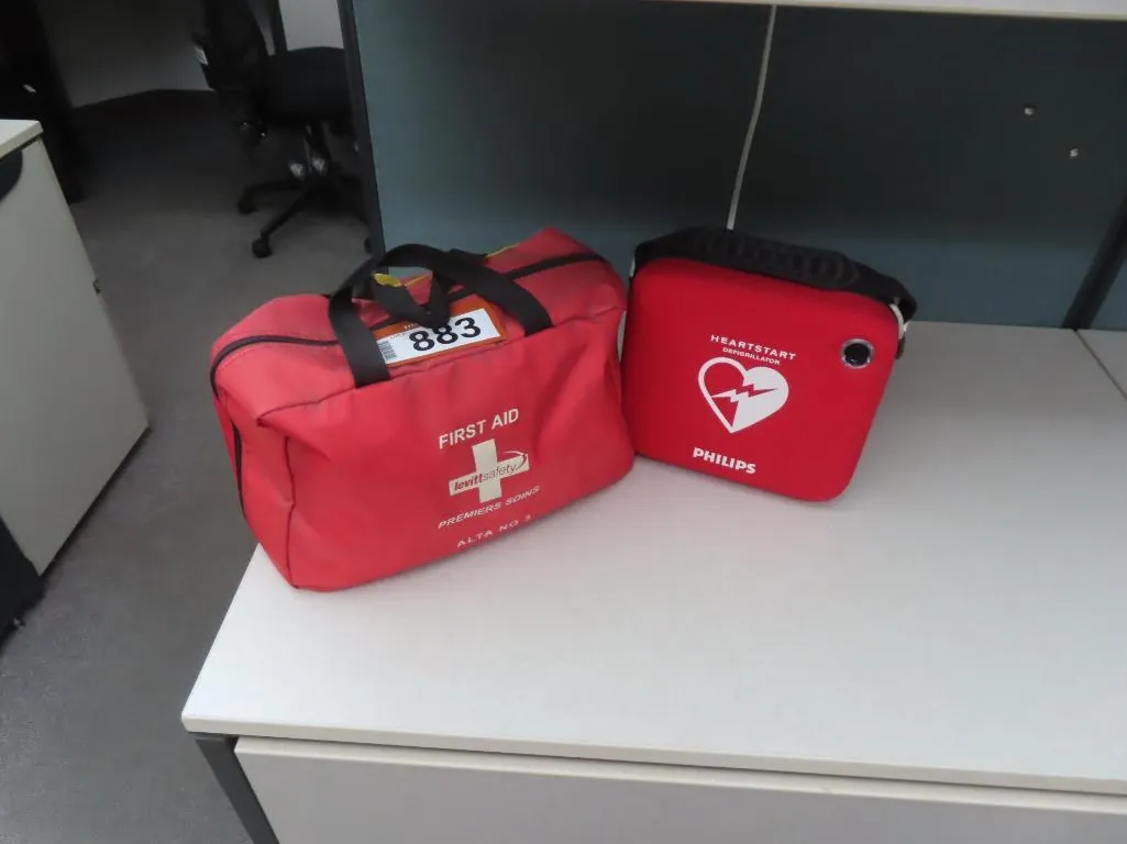 Lot - First Aid Kit, Heart Start Defibrillator *Located at 4831 93 Ave, Edm.