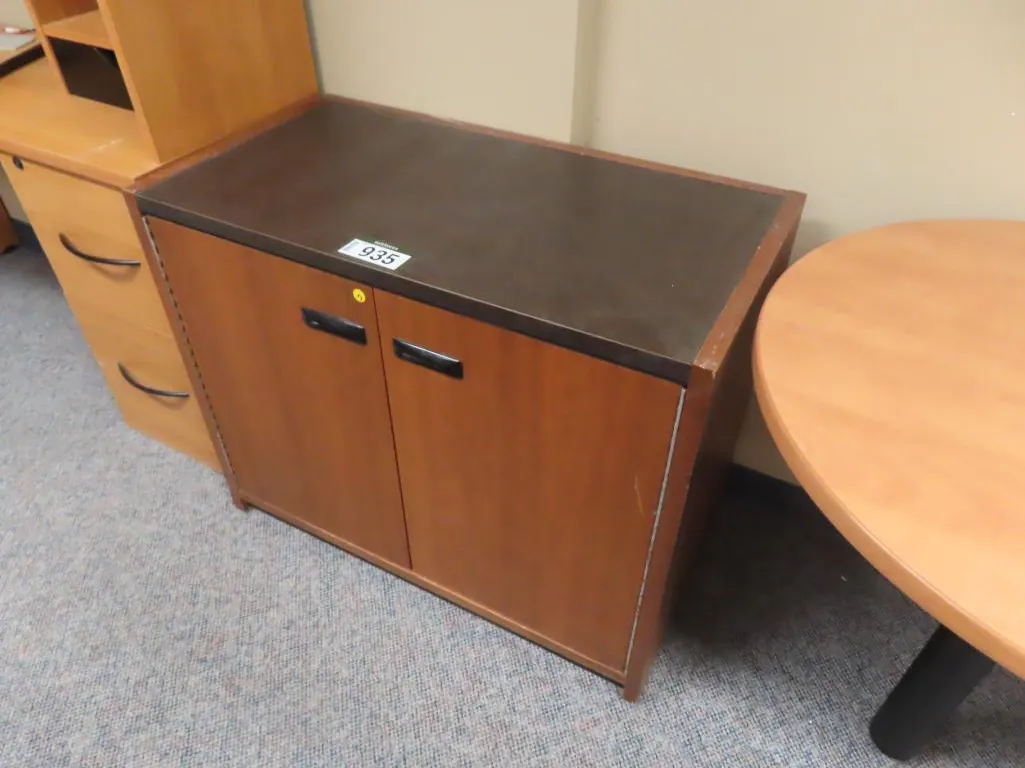 Lot - Brown 2 Door Cabinet, 4 Drawer Horizontal Filing Cabinet, Double Pedestal Desk *Located at 4831 93 Ave, Edm.