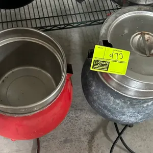 Electric soup warmers. Kettle-style design featuring one red unit and one mottled gray unit. Includes stainless steel inset pans and one stainless ste