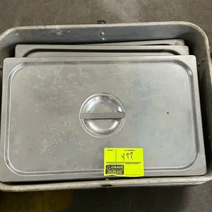 Aluminum roasting pan. Features aluminum construction with drop handles. Includes assorted metal pan lids.