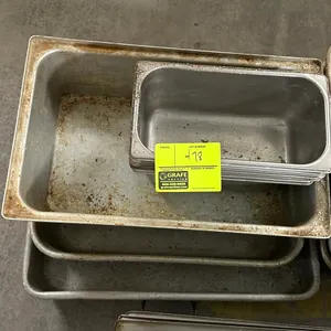 Assorted insert pans and baking pans. Includes stainless steel insert pans and aluminum baking/roasting pans in various sizes.