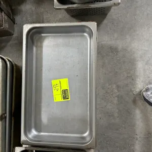 Stainless steel insert pan. Features a full-size commercial food pan design with reinforced rim.