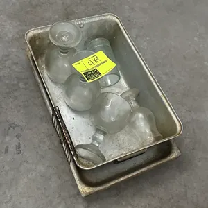 Metal insert pans with assorted glassware. Includes assorted glassware including stemmed glasses.