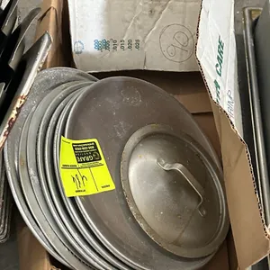 Assorted pizza pans and lid. Aluminum construction. Includes assortment of round baking pans and handled lid.