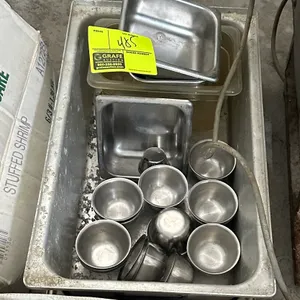 Assorted food pan inserts and stainless steel ramekins. Includes full-size stainless steel food pan, fractional stainless steel and plastic insert pan