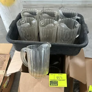 Polycarbonate beverage pitchers with plastic bus tub. Features clear fluted plastic construction, integrated handles, and ice guard spouts. Includes b