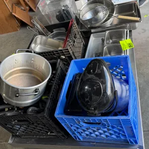 Commercial kitchenware and storage assortment. Includes coffee airpot, assorted stainless steel and aluminum pans, stock pot, sieves/strainers, clear 