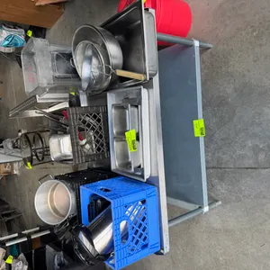 Stainless steel work table. Features a stainless steel top, galvanized undershelf, and galvanized tubular legs with adjustable bullet feet. Contents n