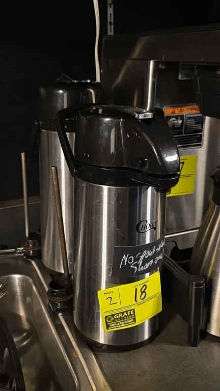 Choice stainless steel airpot coffee dispensers. Features lever-action pump tops, integrated carry handles, and stainless steel construction with blac