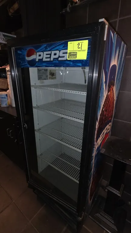 True GDM-12 self-contained glass door beverage display cooler. Features Pepsi exterior graphics, hinged glass door, and (4) adjustable wire shelves. S
