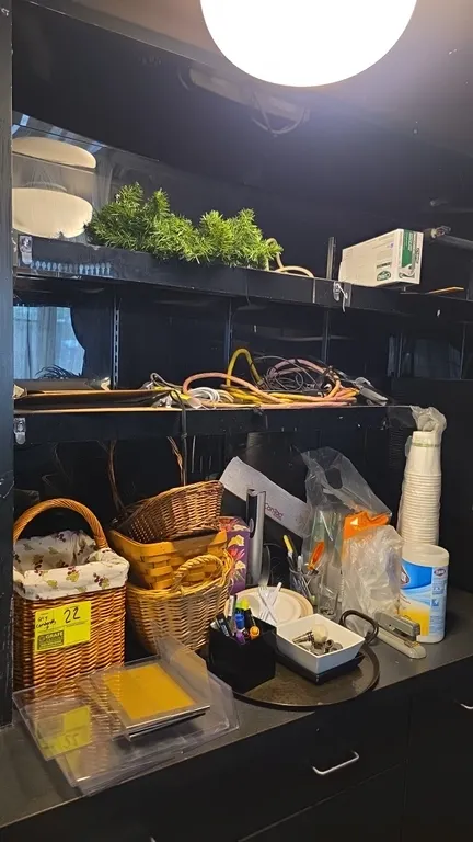 Assorted smallwares and supplies lot. Includes woven baskets, serving tray and dish, clipboards, office supplies, extension cords, power strip, dispos
