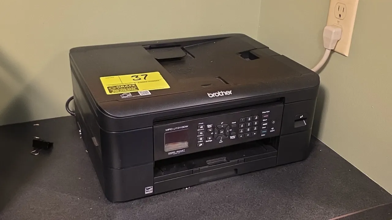 Brother MFC-J1010DW all-in-one printer copier. Features print, scan, copy, and fax capabilities, flatbed scanner, automatic document feeder, and Wi-Fi