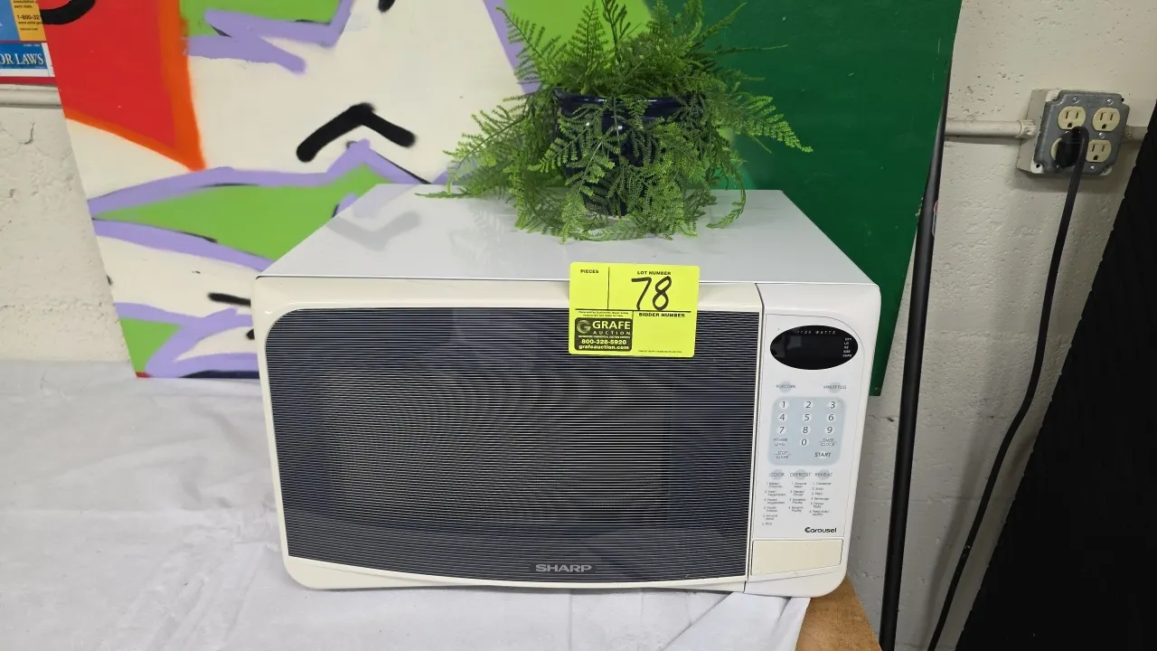 2003 Sharp R-305HW Carousel countertop microwave oven. Features digital keypad controls, 1100W output, and interior glass turntable. S/N: 126999. Elec