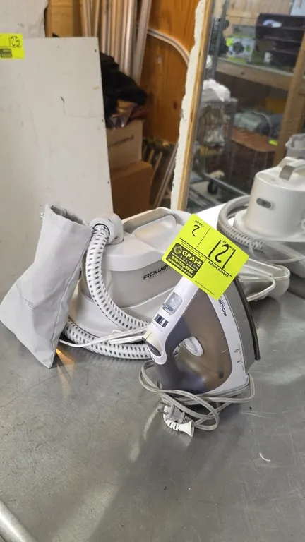 Rowenta steam iron and garment steamer set. Includes a Rowenta Professional steam iron with adjustable temperature dial and burst-of-steam controls, a