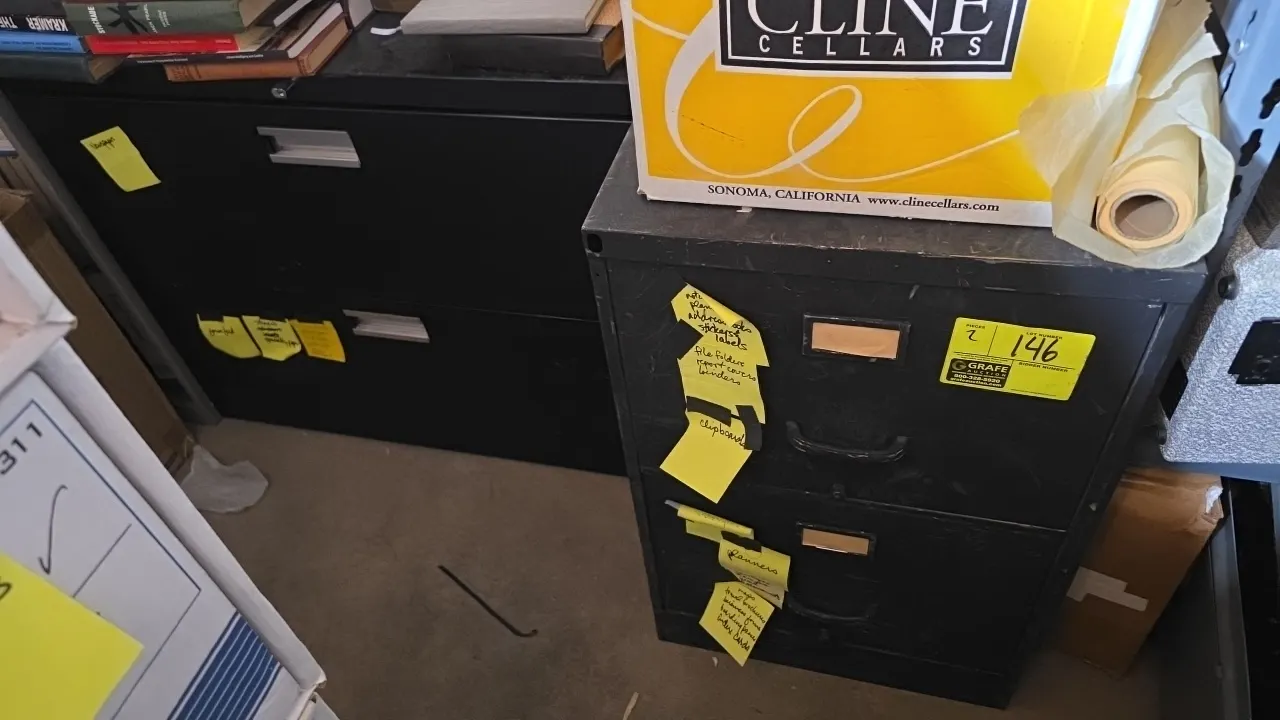 Metal 2-drawer filing cabinets including (1) lateral file cabinet and (1) vertical file cabinet. Includes contents of assorted paper products, newspap