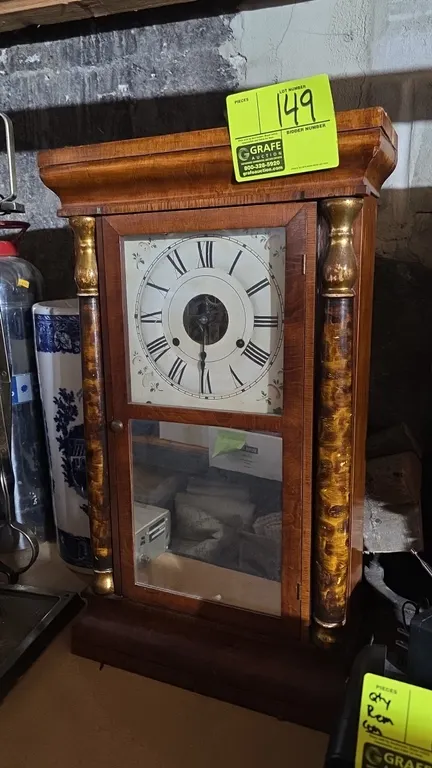 An Antique Seth Thomas Column Mantel Clock. (Seth Thomas, 19th Century) A mechanical wooden shelf clock featuring gilt-accented columns, a painted dia