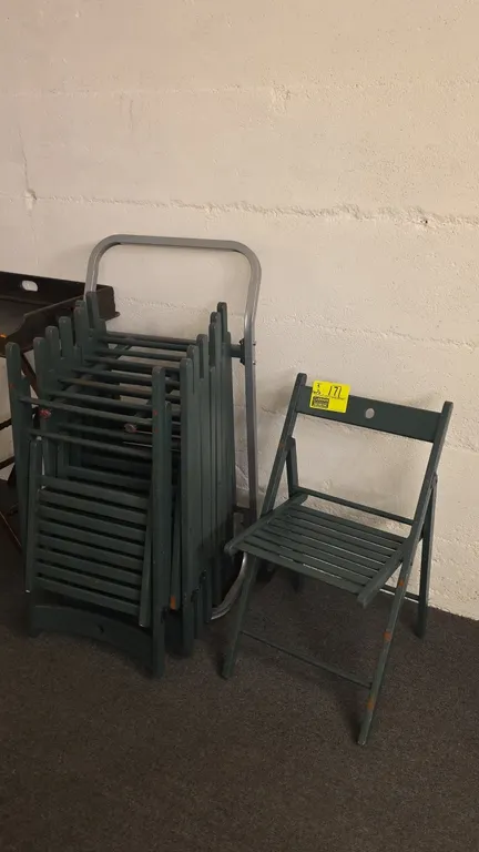 Wood folding chairs. Features green painted wood construction, slatted seats, and folding frames. Includes wheeled metal chair cart. Tray table in bac