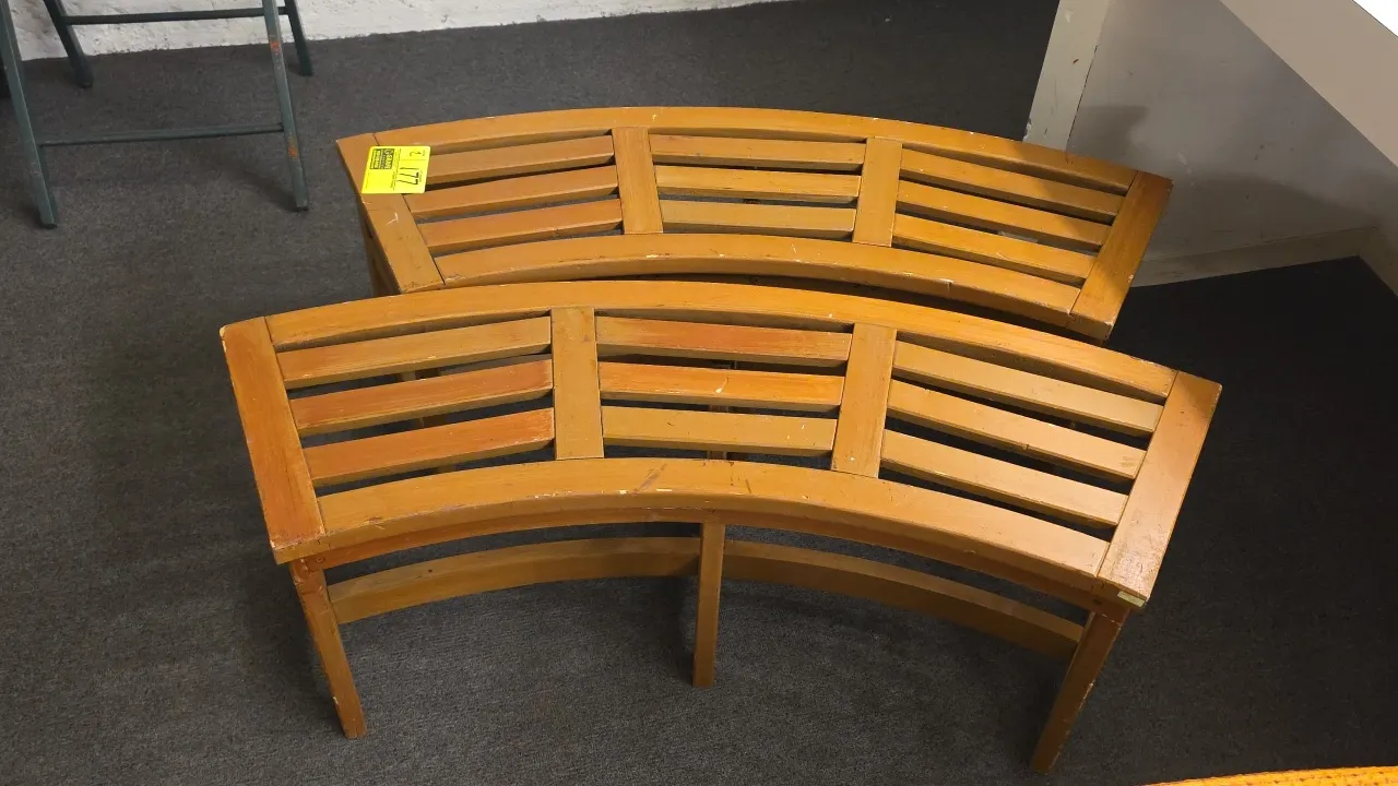 Curved wood benches. Features slatted wood seat construction. 44" x 16"H.