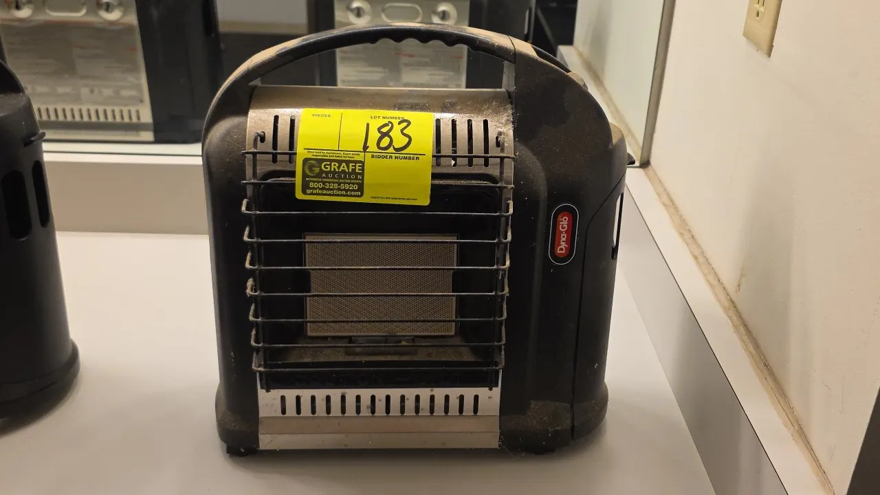 Dyna-Glo RMC-8001SS portable propane gas heater. Features integrated carrying handle, protective wire safety guard, and variable heat control knob. Ra