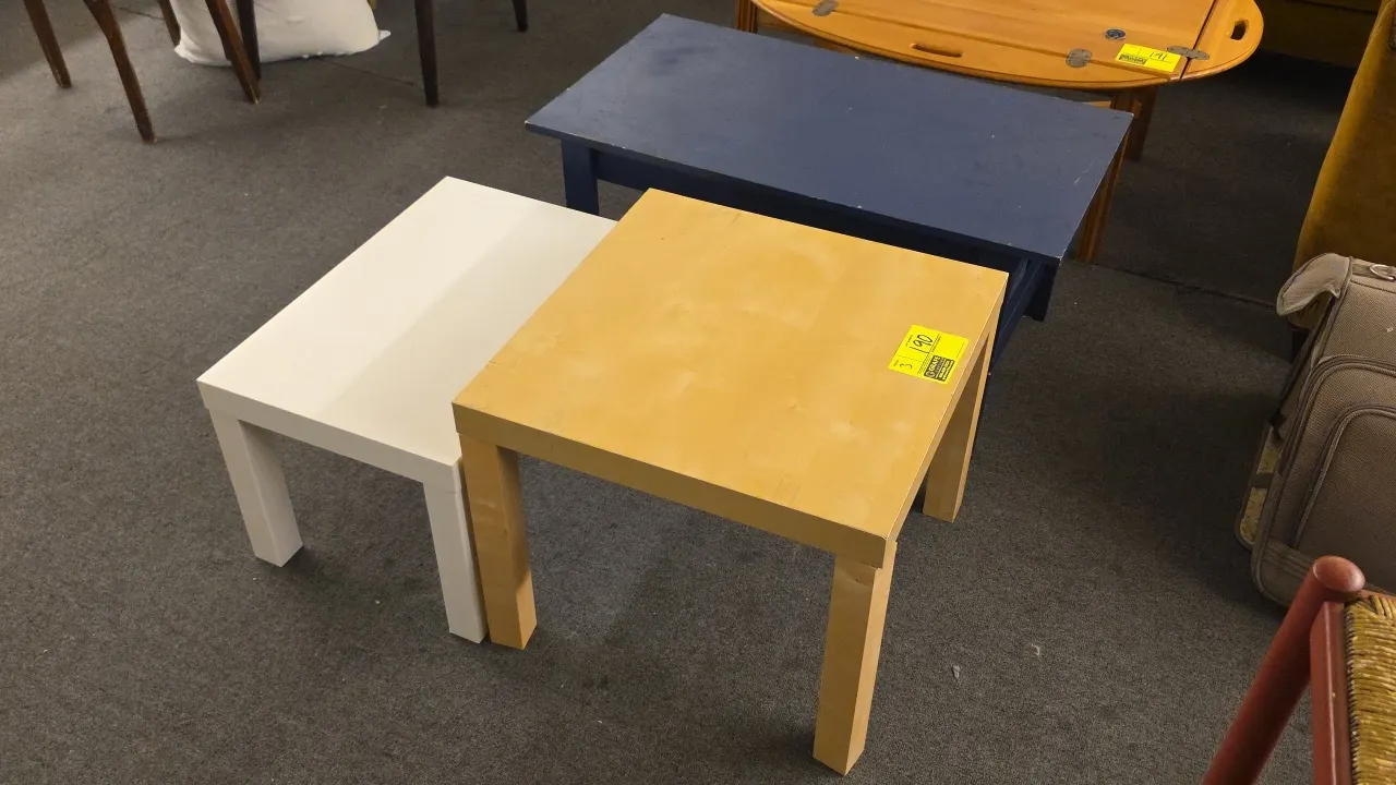 Assorted accent and coffee tables. Includes (1) 36" painted wood table and (2) laminate wood tables measuring 22" and 24". Features blue, white, and n