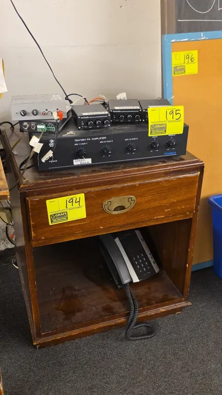 Wood end table. Features single upper drawer with brass-tone pull handle and open lower storage compartment. 21" x 24". Contents not included.