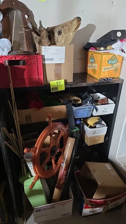Metal 4-tier shelving unit. Features black metal construction. 35" x 13" x 43". Contents not included.