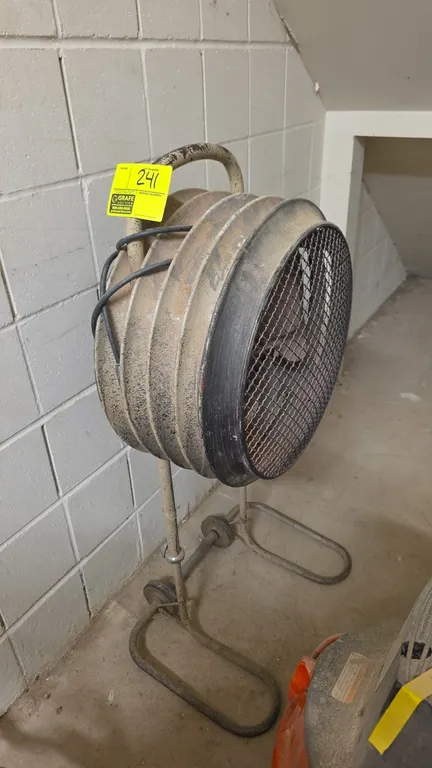 20" portable floor fan. Features a wire mesh safety guard, integrated top carry handle, and directional tilt. Mounted on an adjustable-height tubular