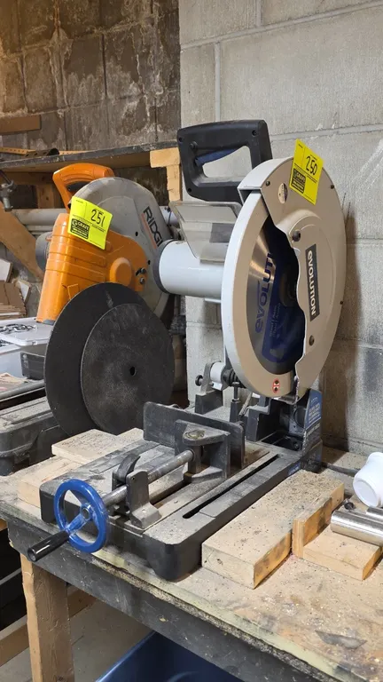 Evolution 15" industrial steel cutting chop saw. Features integrated quick-release material clamp with handwheel, protective safety shield, blade guar