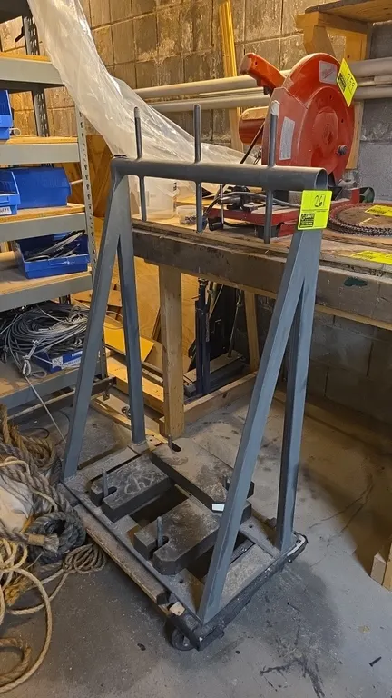 Steel mobile storage cart. Features welded steel A-frame construction, top hanging prongs, and slotted base plates with locator pins. 29" x 18" x 52".