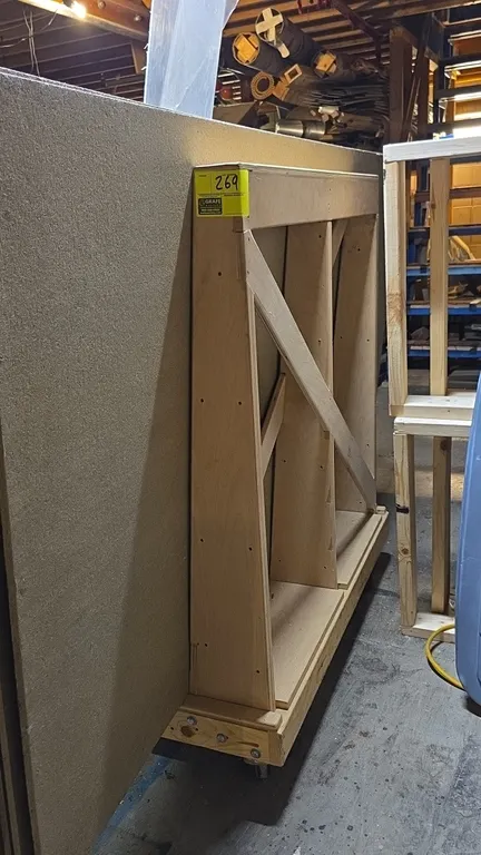 Wood platform cart. Features upright support frame for sheet materials. 4' x 2' x 4'6". Mounted on casters. Materials not included.
