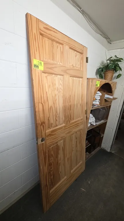 6-panel wood door. Features natural wood grain finish and attached mounting hinges. 36"W x 1.5"D x 80"H.