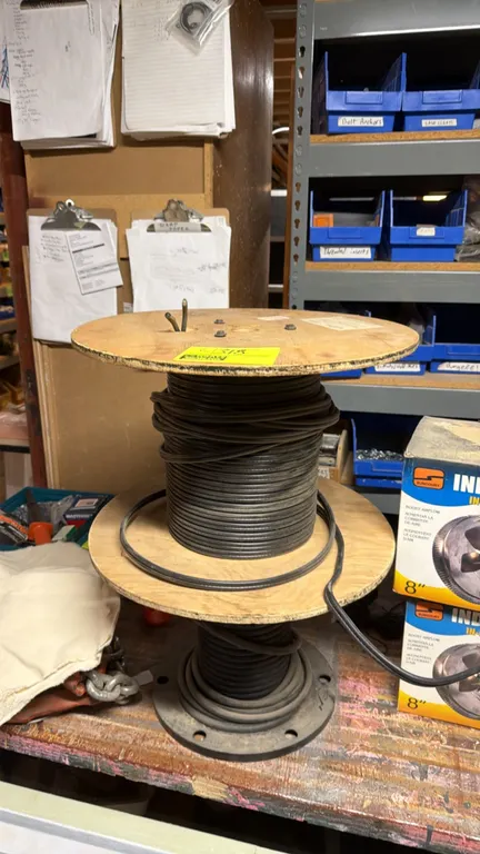 Assorted spools of electrical wire. Includes multi-conductor cable and 2-conductor wire wound on wooden and composite reels.