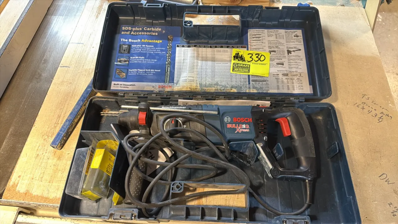 Bosch Bulldog Xtreme corded rotary hammer drill. Features SDS-plus chuck system, adjustable side handle, and depth gauge rod. Electrical: 120V. Includ
