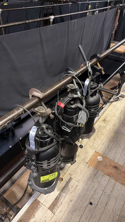 Altman professional theater spotlight fixtures. Features mounting yokes with C-clamps, gel frame holders, and safety cables. Electrical: 120V. Mountin