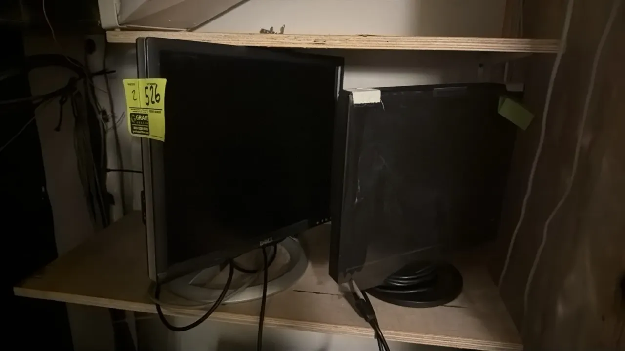 Assorted LCD computer monitors. Features (1) Dell monitor and (1) widescreen display. Mounted on desktop stands.