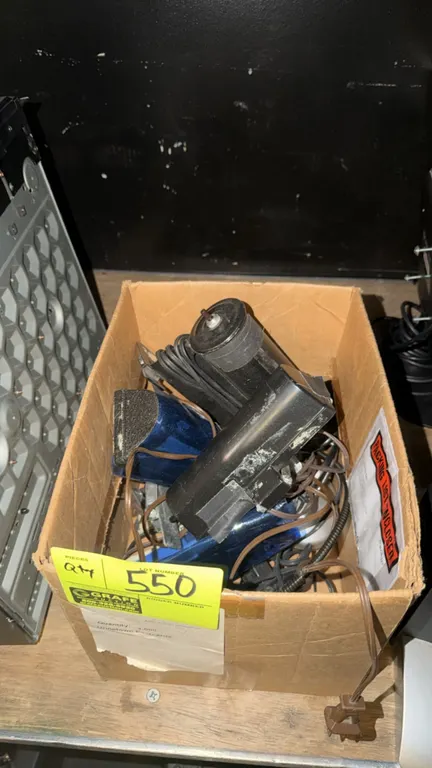 Assorted lighting fixtures and accessories. Includes various small display and accent lights with power cords, contained in a cardboard box.