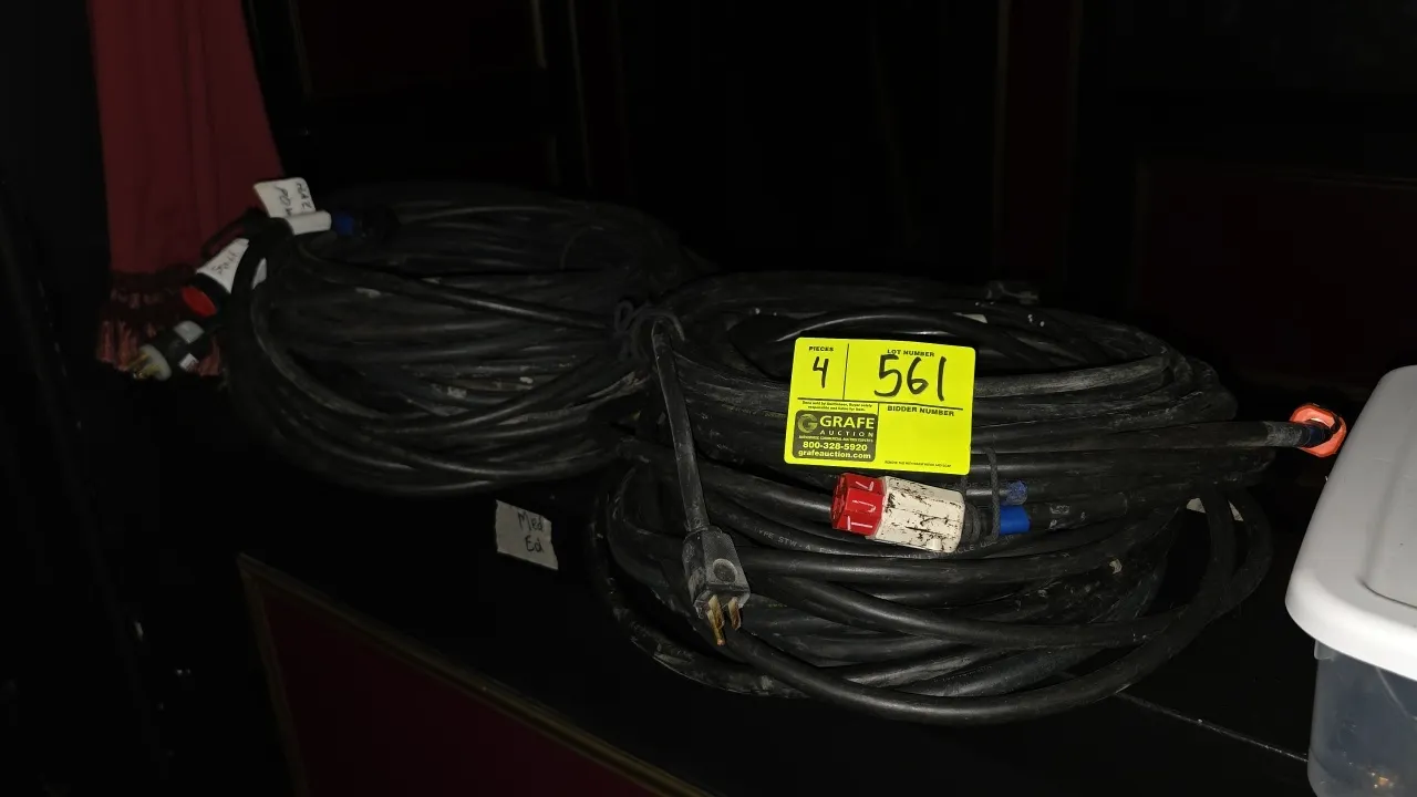 Heavy-duty extension cords. Features flexible black jackets with molded and assembled male plugs and female connectors.