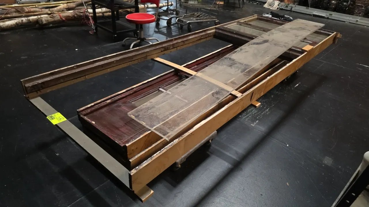 Assorted architectural wood pieces and trim components with (2) carpeted platform dollies. Includes clear acrylic sheet. Approx. 11'L.